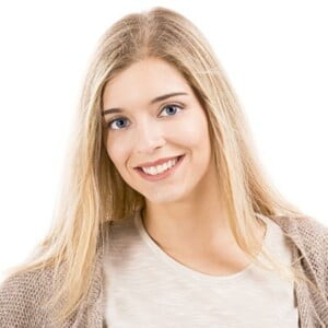 Portrait of a beautiful blonde woman smiling, isolated over white background